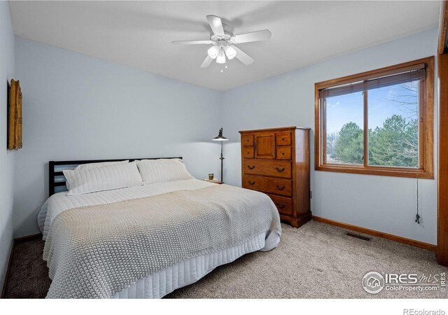 bedroom featuring ceiling fan and carpet flooring