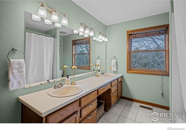 bathroom featuring vanity and tile patterned flooring