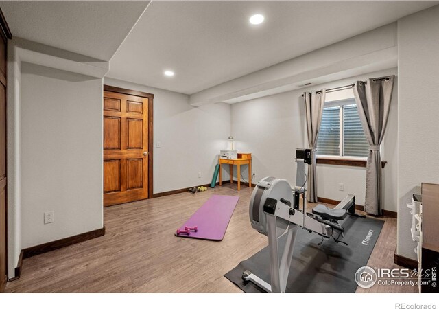 exercise area with hardwood / wood-style flooring