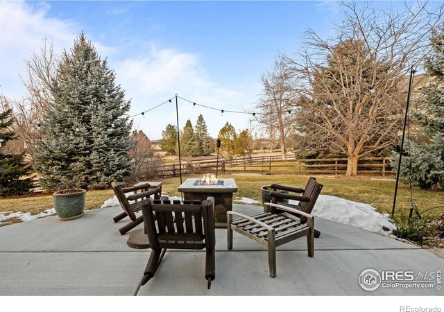 view of patio featuring an outdoor fire pit