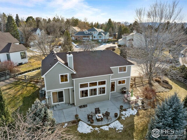 rear view of property featuring central AC and a patio