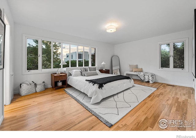 bedroom with light hardwood / wood-style flooring