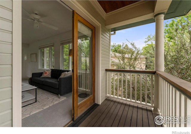 wooden terrace featuring ceiling fan