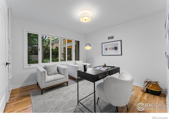 office space with hardwood / wood-style flooring