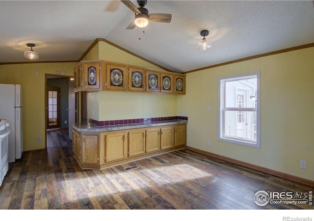 kitchen with vaulted ceiling, dark hardwood / wood-style flooring, crown molding, and white appliances