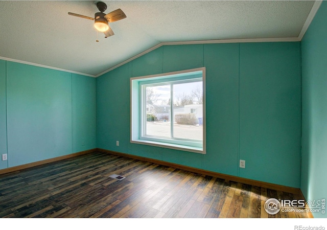 interior space with ceiling fan, lofted ceiling, a textured ceiling, and dark hardwood / wood-style flooring