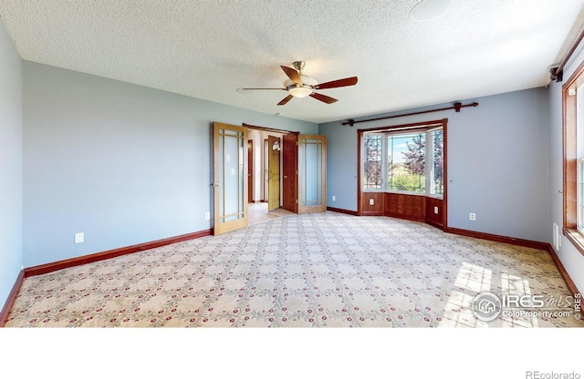 unfurnished bedroom featuring ceiling fan and a textured ceiling