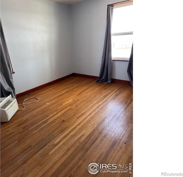 spare room featuring dark hardwood / wood-style floors