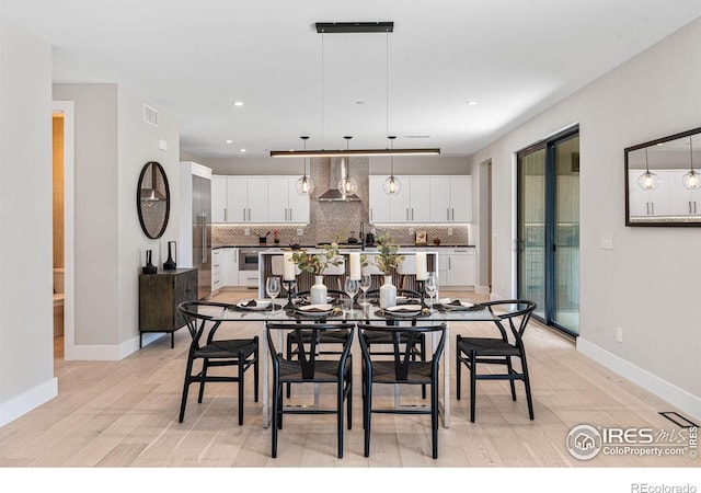 dining area with light wood-type flooring