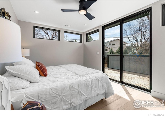 bedroom featuring hardwood / wood-style floors, access to outside, and ceiling fan