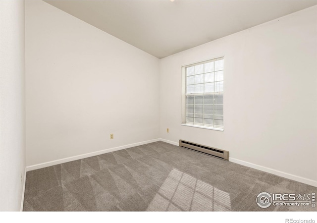 carpeted empty room featuring a baseboard radiator and lofted ceiling