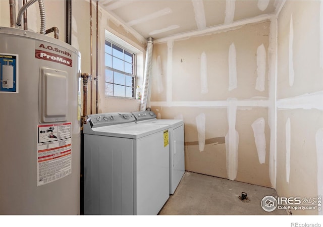 laundry area with independent washer and dryer and water heater