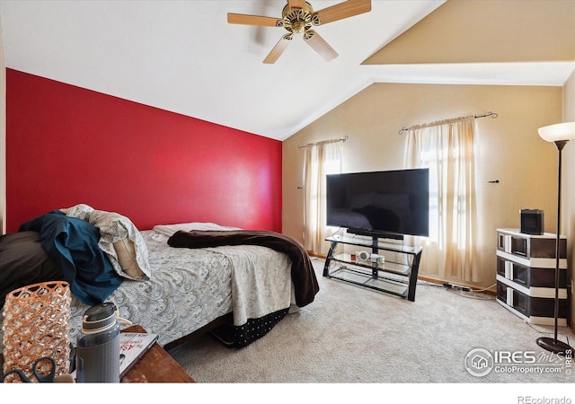 carpeted bedroom with vaulted ceiling and ceiling fan