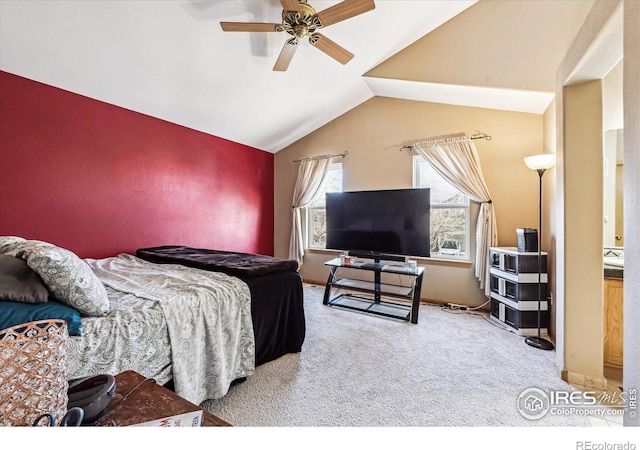 carpeted bedroom featuring vaulted ceiling and ceiling fan