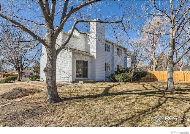 view of property exterior with a lawn