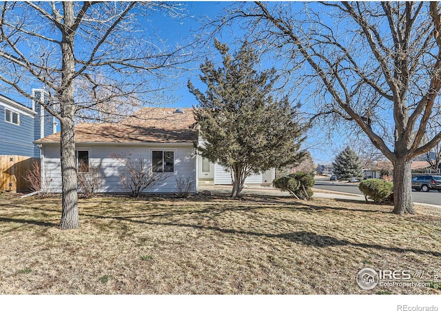 view of front of property with a front lawn