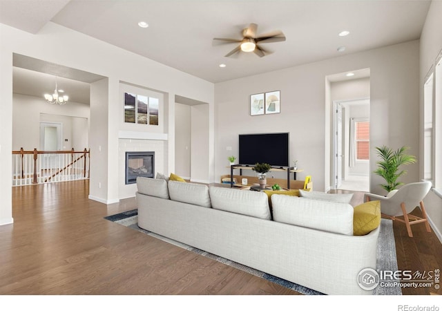 979 Stagecoach Dr, Lafayette, CO 80026 - living area featuring wood finished floors, baseboards, recessed lighting, a glass covered fireplace, and a ceiling fan