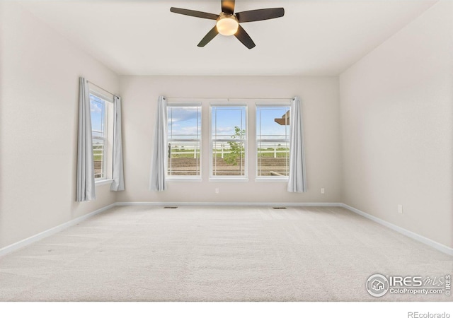 979 Stagecoach Dr, Lafayette, CO 80026 - carpeted empty room with a ceiling fan and baseboards