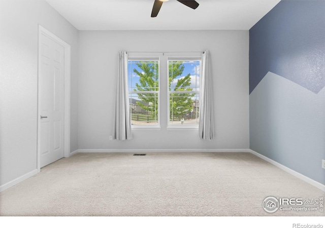 979 Stagecoach Dr, Lafayette, CO 80026 - carpeted spare room with a ceiling fan and baseboards