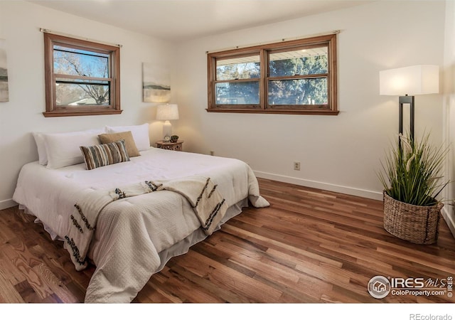 bedroom featuring dark hardwood / wood-style floors