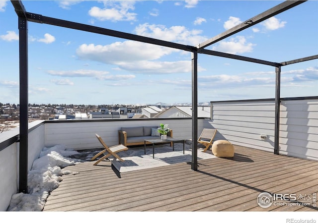 wooden deck with an outdoor living space