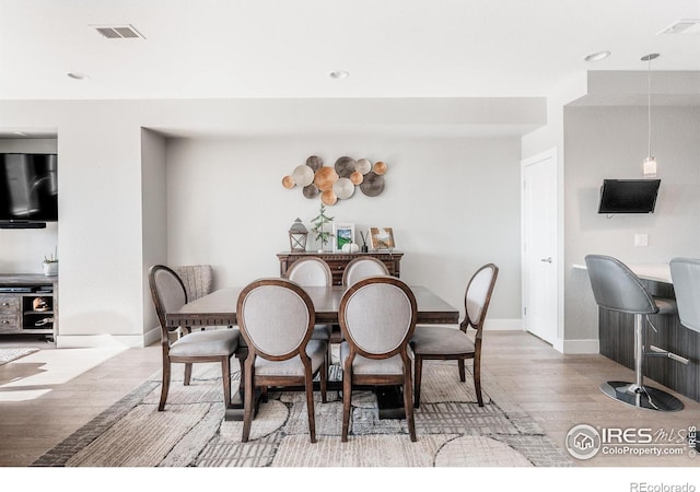 dining space featuring light hardwood / wood-style floors