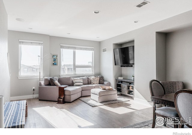 living room with light hardwood / wood-style flooring