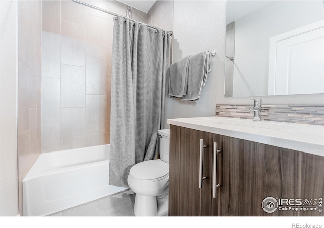 full bathroom featuring shower / tub combo, vanity, and toilet