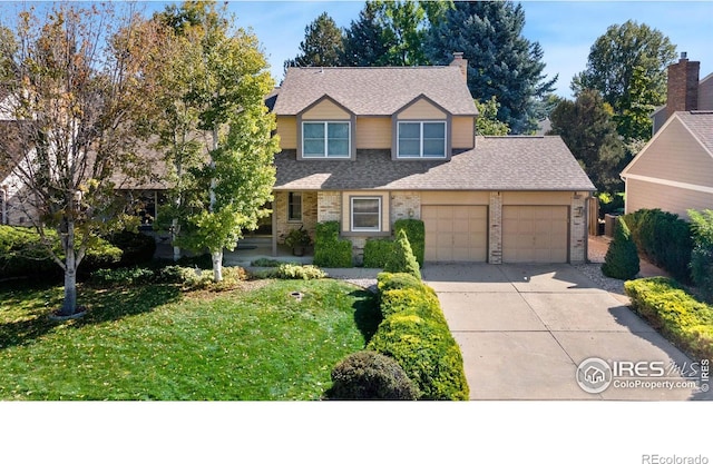 view of front property with a garage and a front lawn