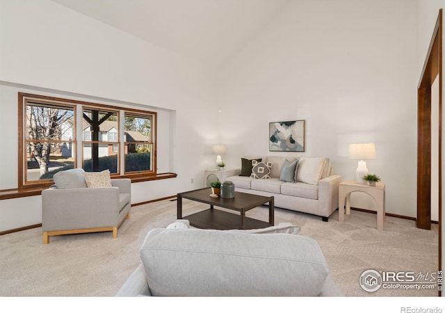 living room featuring light carpet and high vaulted ceiling