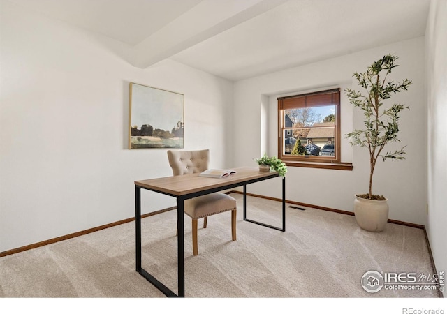 home office featuring light carpet and beam ceiling