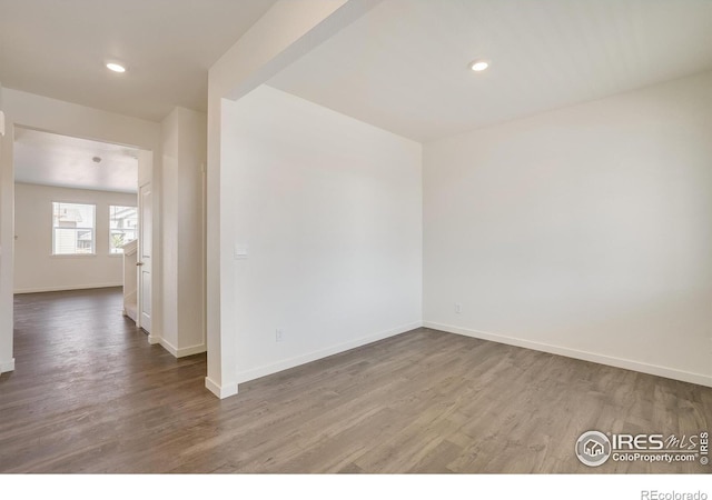 empty room featuring wood-type flooring