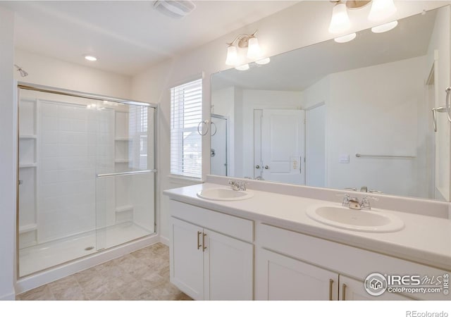 bathroom featuring vanity and walk in shower