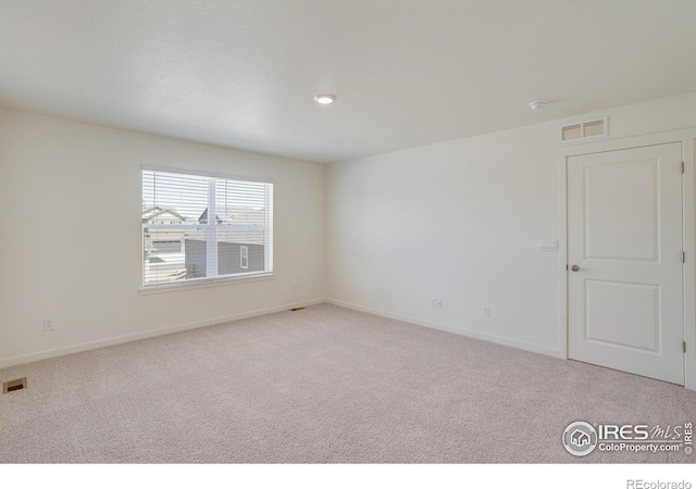 view of carpeted spare room