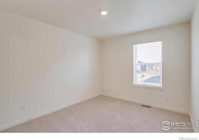 empty room with carpet flooring