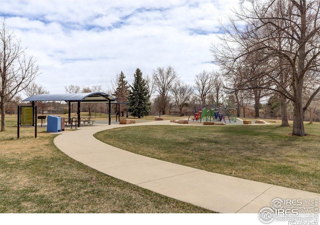 view of community with a gazebo, a playground, and a lawn