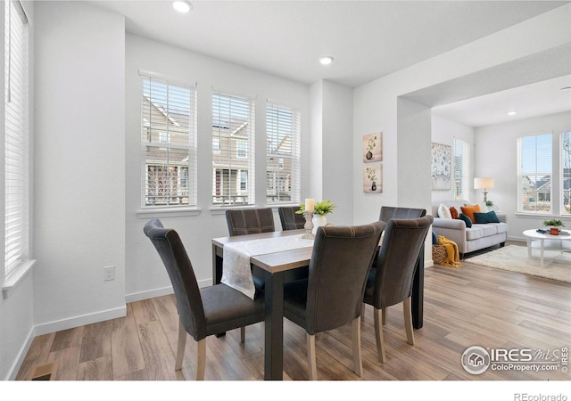 dining room featuring light wood-type flooring