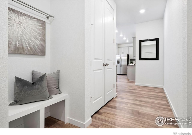 corridor featuring light hardwood / wood-style flooring