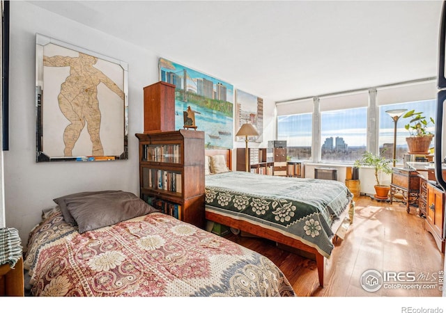 bedroom featuring hardwood / wood-style flooring