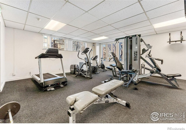 workout area with a paneled ceiling