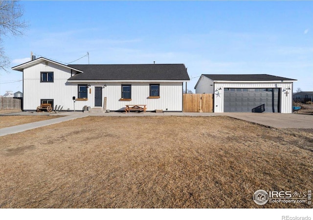 view of front of house with a garage and a front lawn