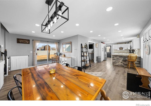 dining room with light hardwood / wood-style flooring