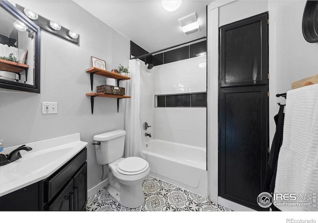 full bathroom featuring vanity, toilet, tile patterned flooring, and shower / bath combo with shower curtain