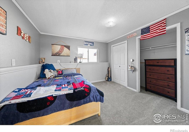 bedroom featuring crown molding, light carpet, and a textured ceiling