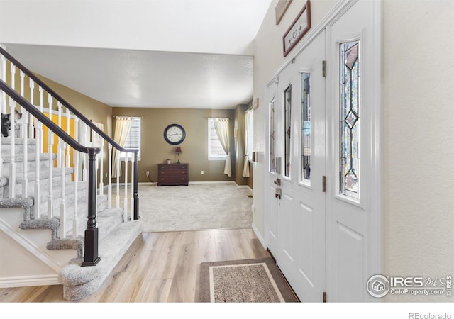 foyer with light hardwood / wood-style floors