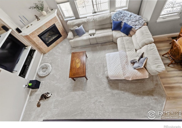 living room with a tile fireplace