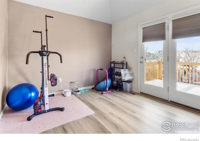 exercise room with hardwood / wood-style flooring