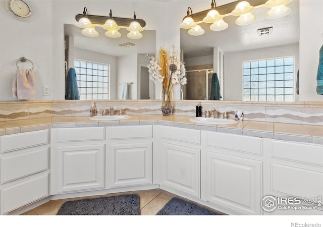 bathroom featuring tile patterned flooring and vanity