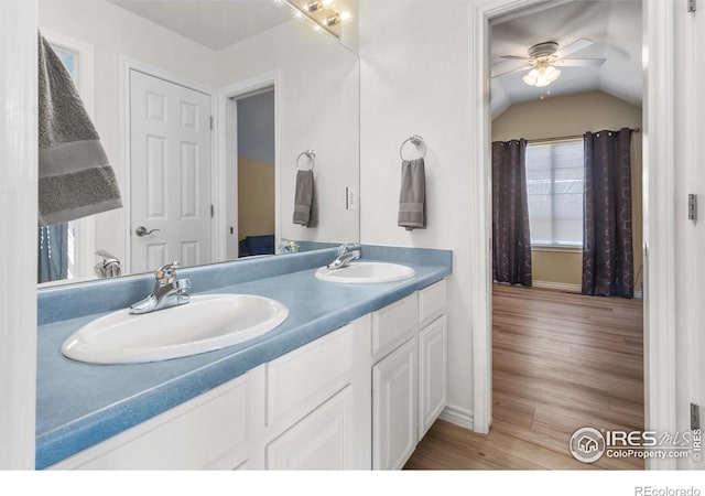 bathroom with hardwood / wood-style flooring, vanity, lofted ceiling, and ceiling fan