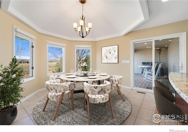 dining area featuring an inviting chandelier and light tile patterned floors